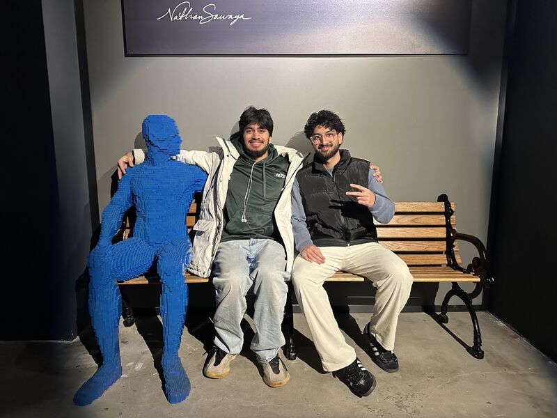 The founding Gym Clock team on a bench: Affan left, Ibrahim right